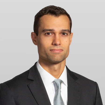 Francisco Morales, a man with dark brown hair, wears a white shirt, silver tie and black jacket.