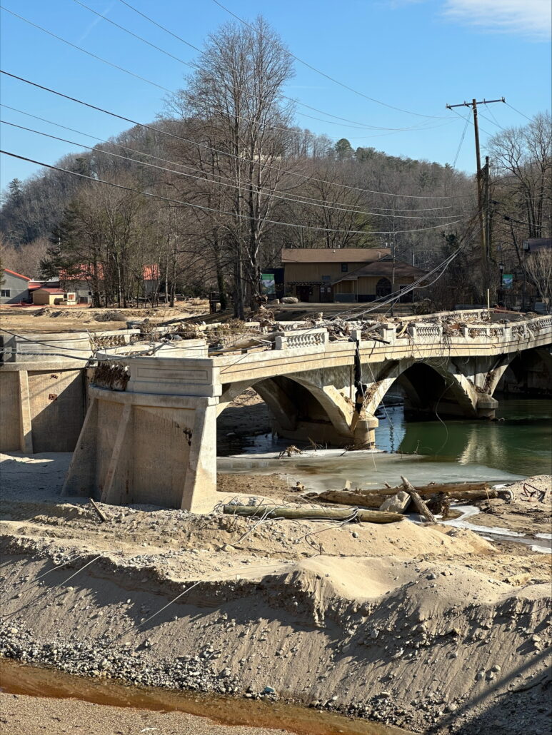 The image shows two roads that have been washed away.