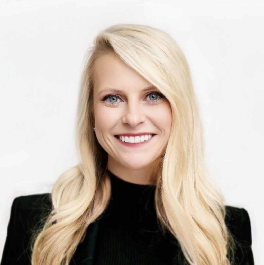 Jessica, a white woman with blond hair, wears a black dress.